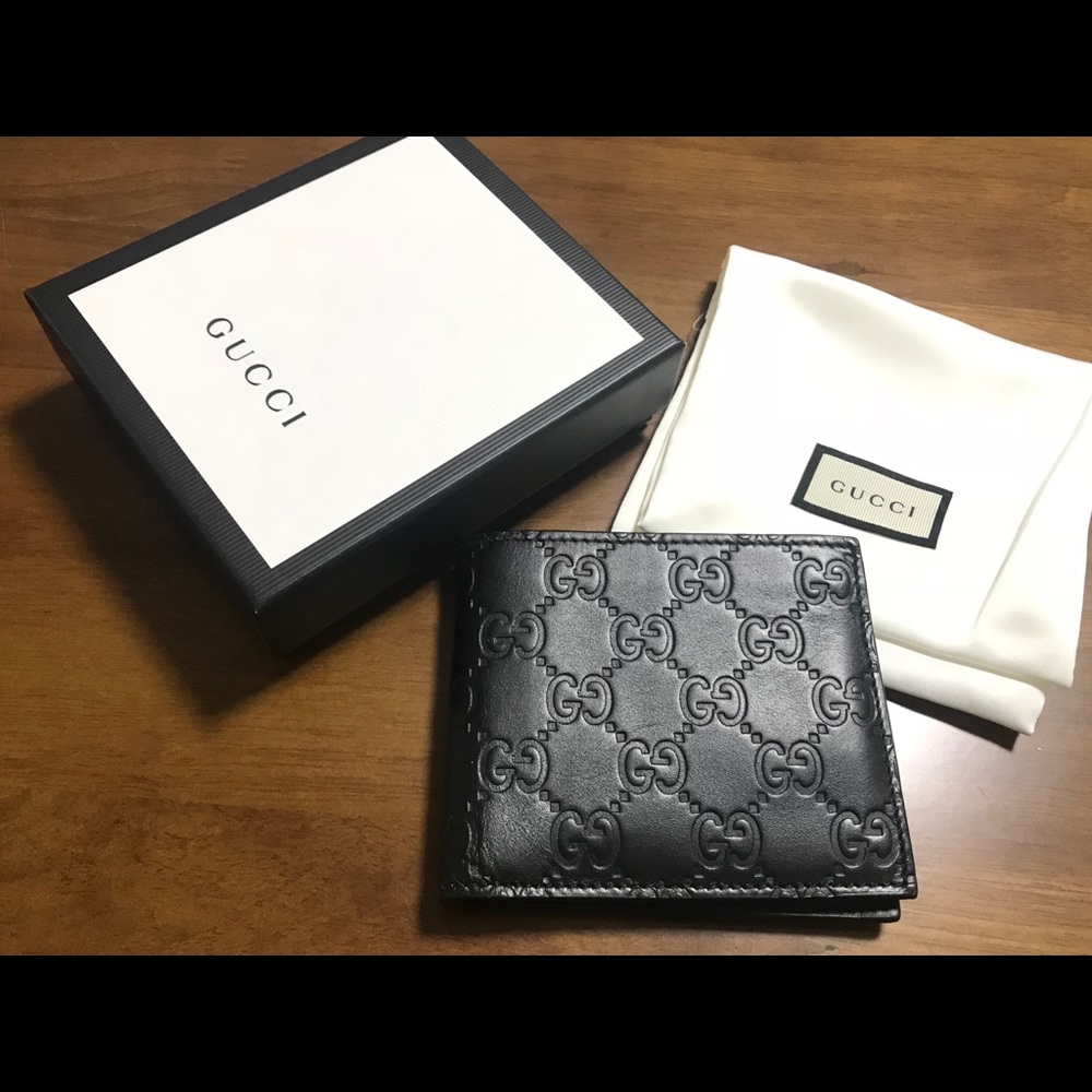 Gucci signature embossed leather wallet black